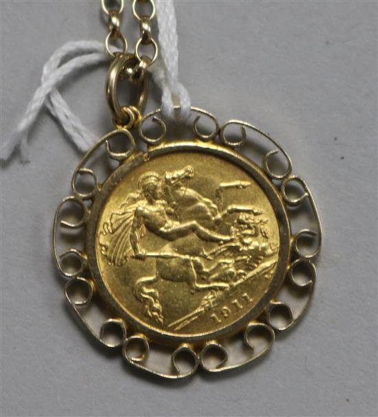 A 1911 gold half sovereign, in 9ct gold pendant mount and chain.